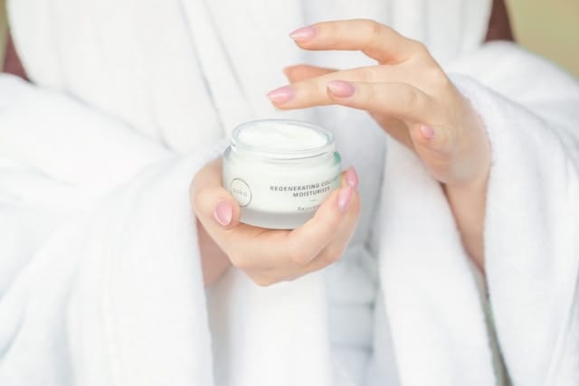 Skincare and beauty products arranged on a vanity